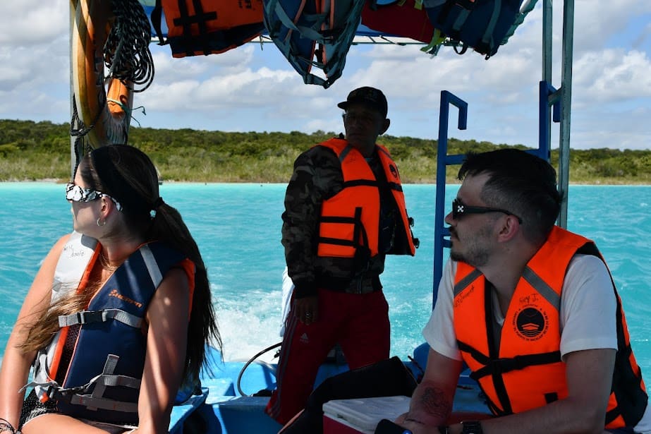  private boat gliding over the crystal-clear waters of Bacalar Lagoon