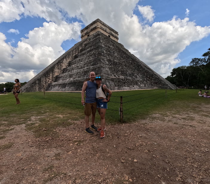 Visitors exploring the ancient ruins of Chichen Itza