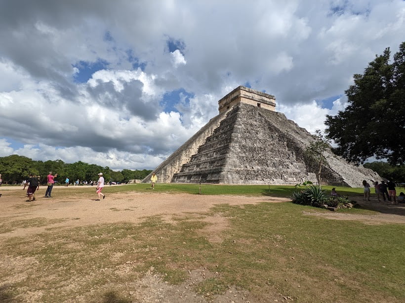 Tourists exploring ancient ruins in the Yucatan